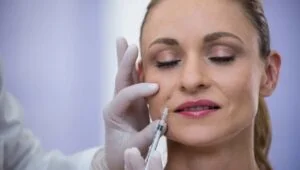 Patient receiving dermal filler treatment at Unik Glow Aesthetics in Sale, Cheshire